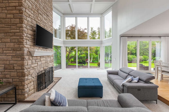 3211 Treyburn Rd, Naperville, IL 60564 - living area with a towering ceiling, a fireplace, coffered ceiling, and beam ceiling