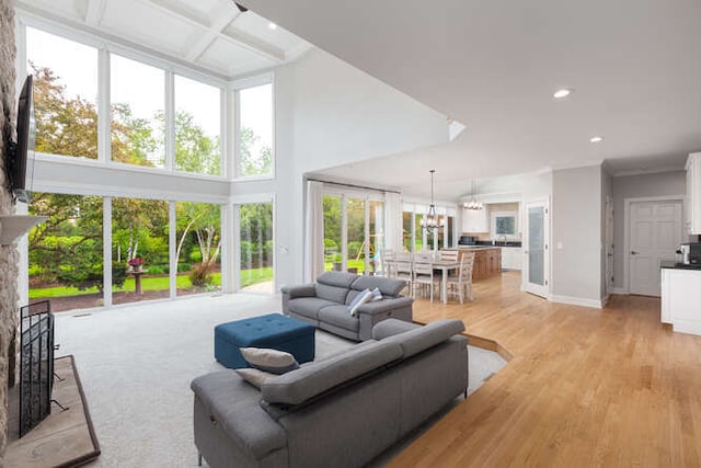 3211 Treyburn Rd, Naperville, IL 60564 - living room featuring recessed lighting, baseboards, light wood-style floors, beamed ceiling, and a towering ceiling