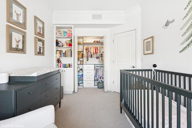 959 W 37th St Unit 5, Chicago, IL 60609 - bedroom featuring a nursery area, ornamental molding, and light carpet