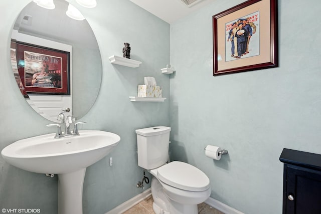 959 W 37th St Unit 5, Chicago, IL 60609 - half bathroom with toilet, tile patterned floors, and baseboards