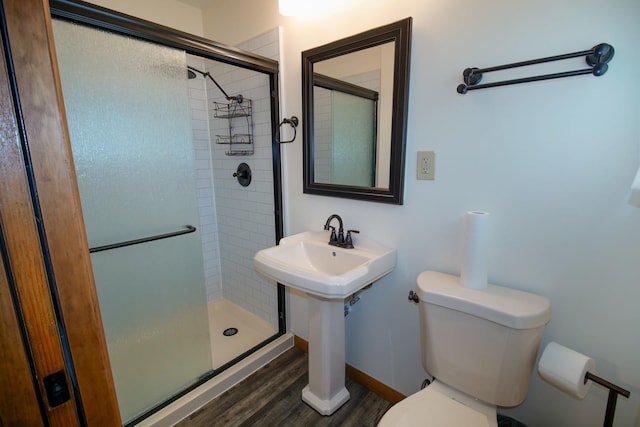 3743 E 112th St, Chicago, IL 60617 - bathroom with toilet, a stall shower, and wood finished floors