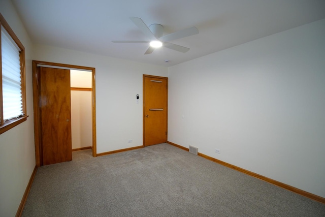3743 E 112th St, Chicago, IL 60617 - unfurnished bedroom featuring light colored carpet, baseboards, a ceiling fan, and a closet
