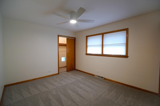 3743 E 112th St, Chicago, IL 60617 - spare room featuring a ceiling fan, light colored carpet, and baseboards