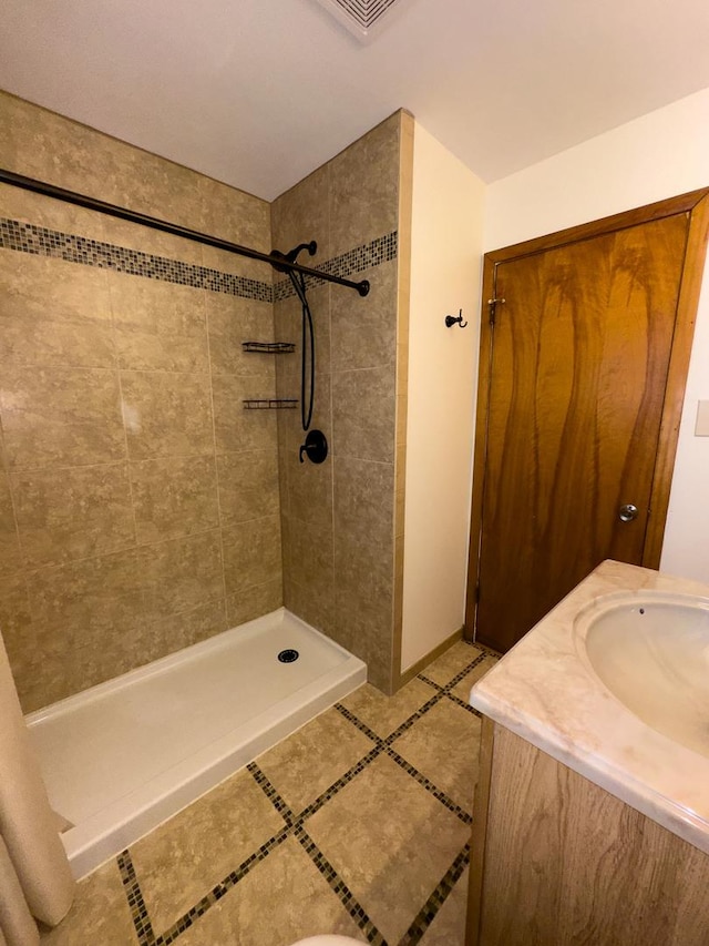 3743 E 112th St, Chicago, IL 60617 - full bathroom featuring a shower stall, vanity, and tile patterned floors