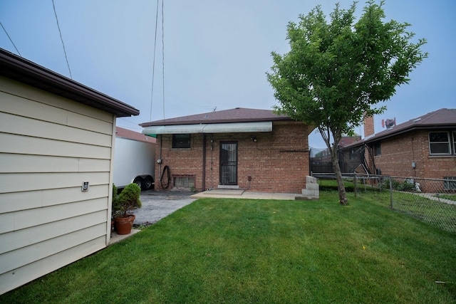 3743 E 112th St, Chicago, IL 60617 - back of house featuring brick siding and a patio area