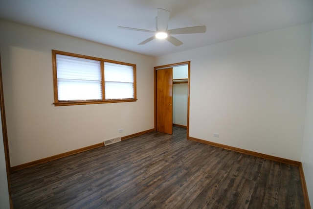 3743 E 112th St, Chicago, IL 60617 - unfurnished bedroom with dark wood finished floors, baseboards, a closet, and ceiling fan