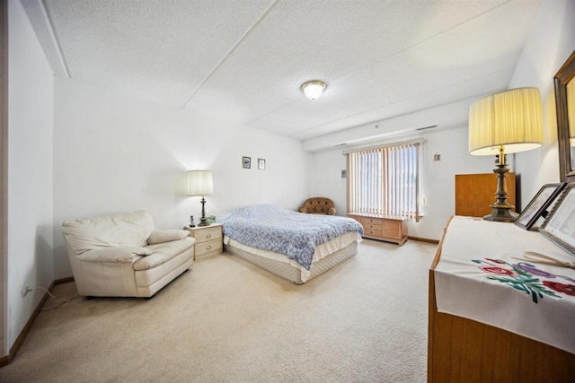 7414 W Irving Park Rd Unit 206, Norridge, IL 60706 - bedroom with light carpet, a textured ceiling, and baseboards