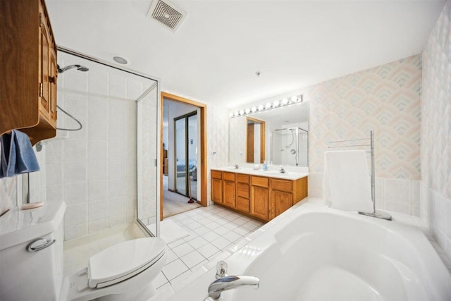 7414 W Irving Park Rd Unit 206, Norridge, IL 60706 - bathroom with a shower stall, toilet, double vanity, a tub, and wallpapered walls