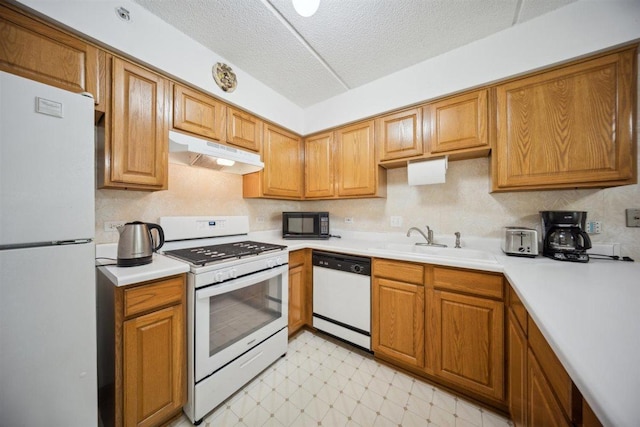 7414 W Irving Park Rd Unit 206, Norridge, IL 60706 - kitchen with white appliances, under cabinet range hood, a sink, light countertops, and a textured ceiling