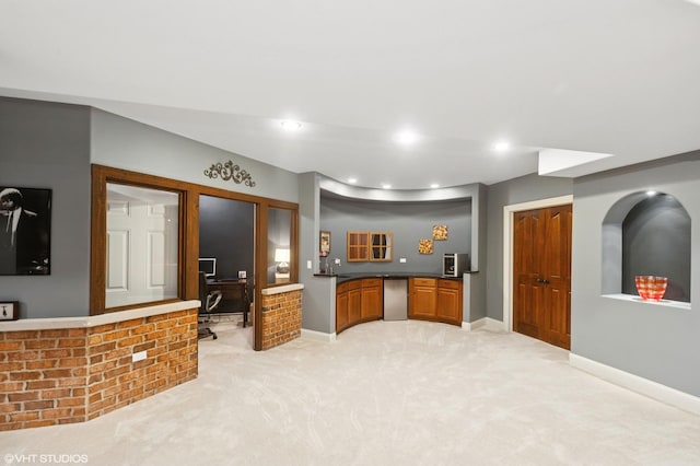 1138 Greentree Ave, Deerfield, IL 60015 - kitchen featuring a desk, baseboards, light colored carpet, dark countertops, and brown cabinets