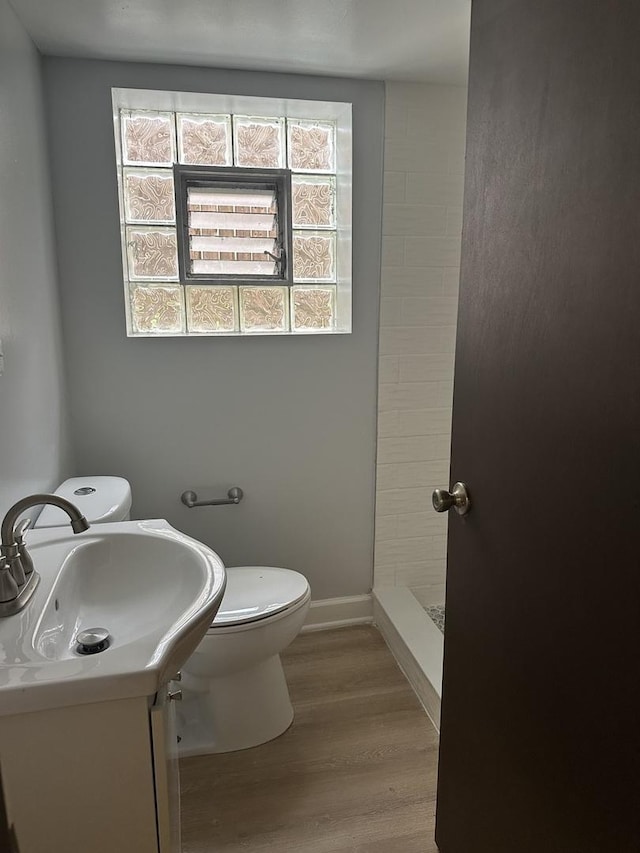 7804 Newland Ave, Burbank, IL 60459 - full bath featuring a stall shower, wood finished floors, and vanity