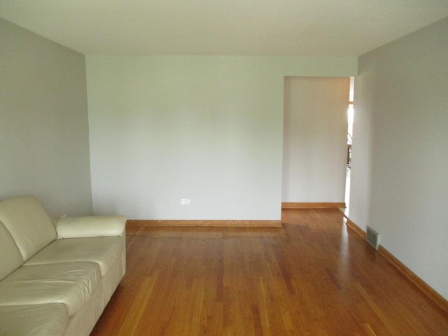 7804 Newland Ave, Burbank, IL 60459 - living area featuring wood finished floors and baseboards