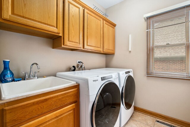 1284 N Jack Pine Ct, Palatine, IL 60067 - washroom with cabinet space, washer and clothes dryer, light tile patterned floors, and baseboards