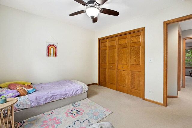 1284 N Jack Pine Ct, Palatine, IL 60067 - carpeted bedroom with baseboards, a closet, and a ceiling fan