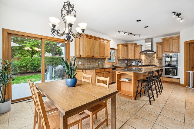 1284 N Jack Pine Ct, Palatine, IL 60067 - dining room featuring a chandelier, light tile patterned flooring, and rail lighting