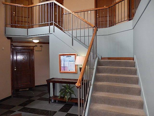 1744 Eastwood Ct Unit 9, Schaumburg, IL 60195 - staircase with baseboards and a towering ceiling