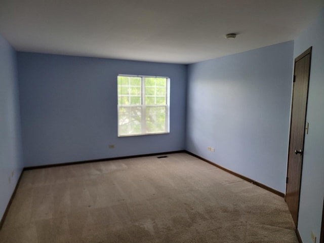 1744 Eastwood Ct Unit 9, Schaumburg, IL 60195 - carpeted empty room featuring baseboards and a smoke detector