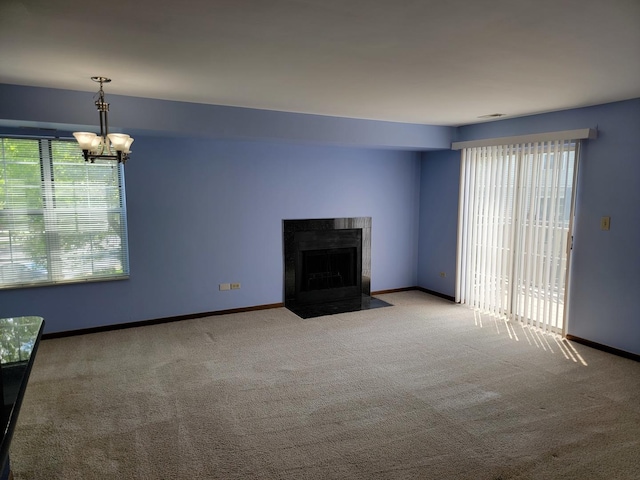 1744 Eastwood Ct Unit 9, Schaumburg, IL 60195 - unfurnished living room with carpet, a chandelier, baseboards, and a fireplace with flush hearth