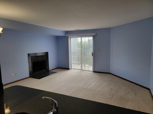 1744 Eastwood Ct Unit 9, Schaumburg, IL 60195 - unfurnished living room featuring carpet, a fireplace with flush hearth, and baseboards