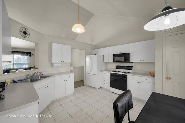 2N562 Atlantic Dr, West Chicago, IL 60185 - kitchen featuring gas stove, black microwave, freestanding refrigerator, a sink, and high vaulted ceiling
