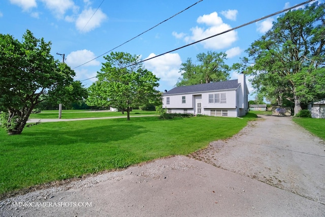 2N562 Atlantic Dr, West Chicago, IL 60185 - bi-level home with asphalt driveway, a chimney, and a front yard