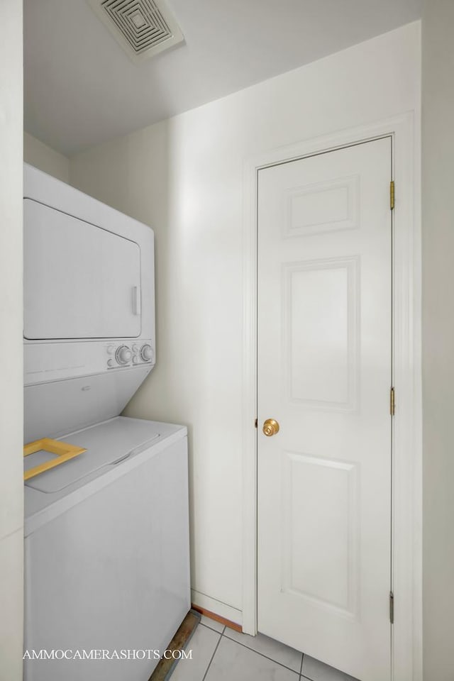 2N562 Atlantic Dr, West Chicago, IL 60185 - washroom with estacked washer and dryer and light tile patterned floors