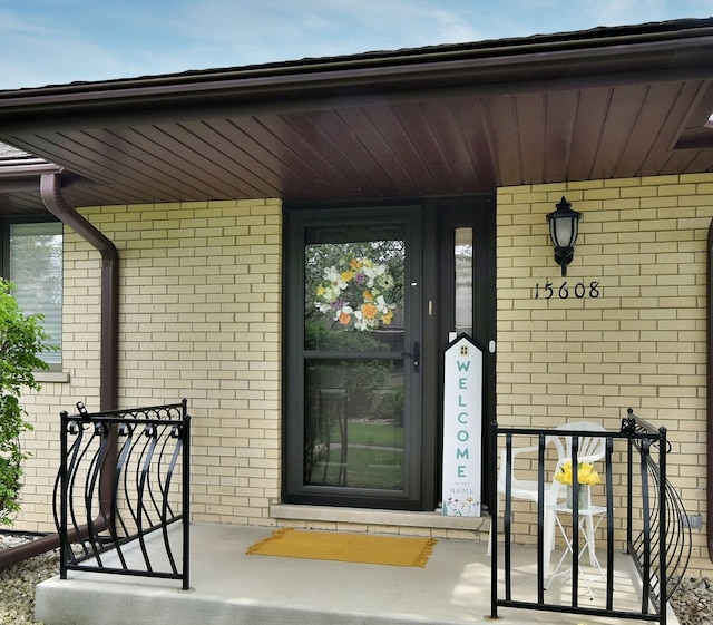 15608 Petunia Ct, Orland Park, IL 60462 - entrance to property with a porch and brick siding
