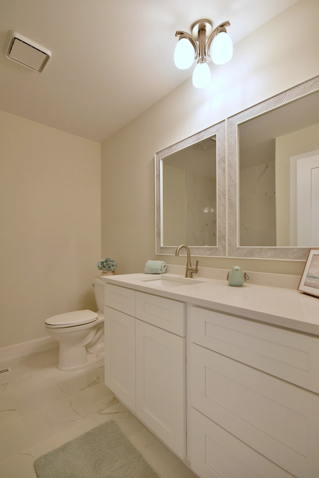 15608 Petunia Ct, Orland Park, IL 60462 - bathroom with marble look tile flooring, toilet, vanity, and baseboards