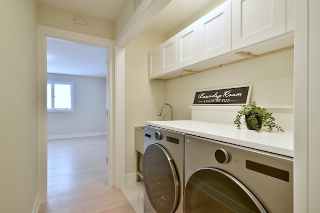 15608 Petunia Ct, Orland Park, IL 60462 - clothes washing area featuring cabinet space, independent washer and dryer, light wood-type flooring, and baseboards