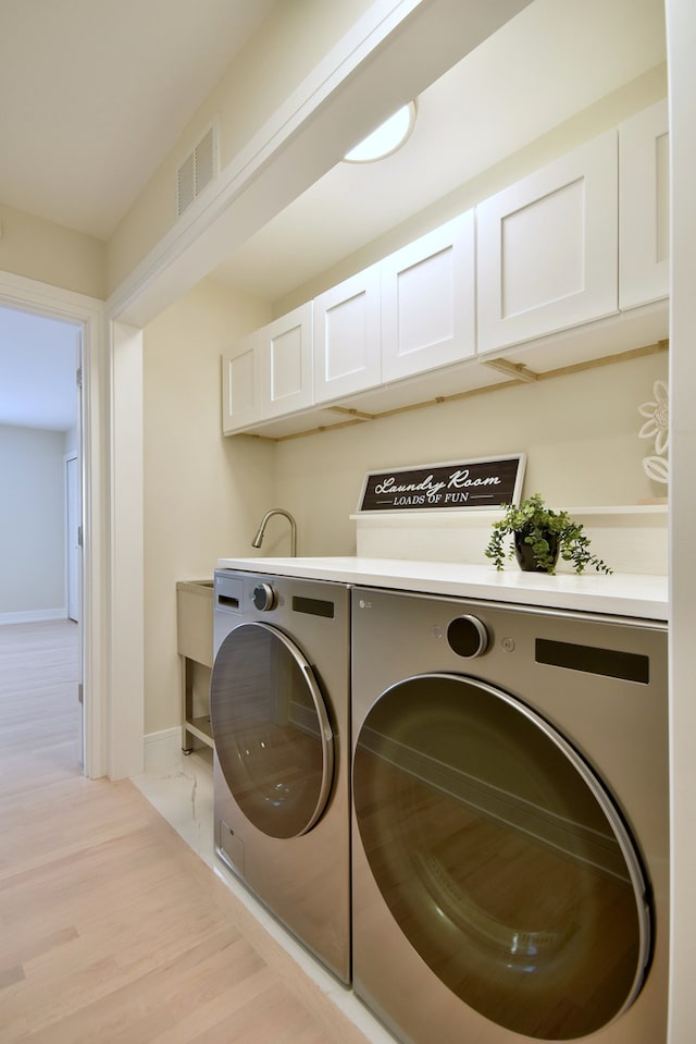 15608 Petunia Ct, Orland Park, IL 60462 - clothes washing area with washer and clothes dryer, baseboards, and cabinet space