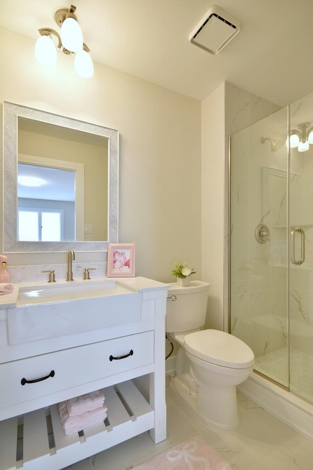 15608 Petunia Ct, Orland Park, IL 60462 - bathroom featuring a marble finish shower, toilet, vanity, and marble look tile flooring