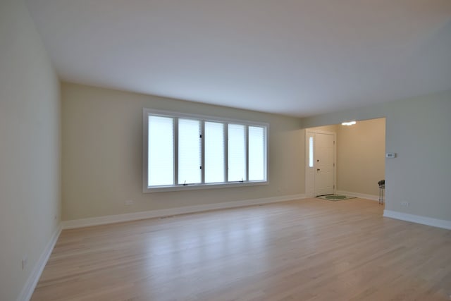 15608 Petunia Ct, Orland Park, IL 60462 - spare room with light wood-style floors and baseboards