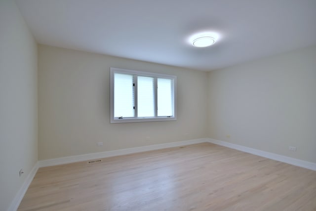15608 Petunia Ct, Orland Park, IL 60462 - unfurnished room with light wood finished floors and baseboards