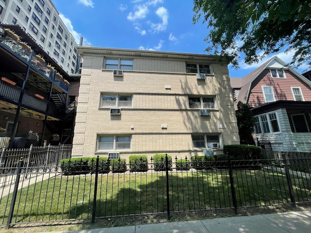 1238 W Pratt Blvd Unit 1A, Chicago, IL 60626 - view of apartment building / complex with a fenced front yard
