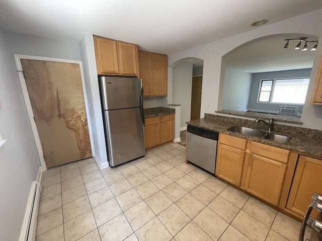 1238 W Pratt Blvd Unit 1A, Chicago, IL 60626 - kitchen featuring stainless steel appliances, a baseboard heating unit, arched walkways, and light tile patterned flooring