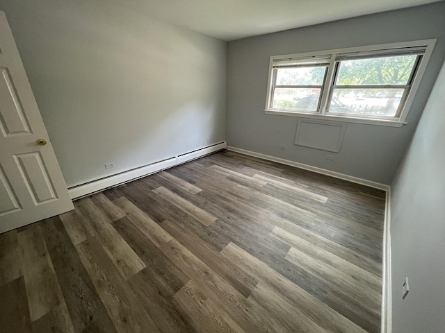1238 W Pratt Blvd Unit 1A, Chicago, IL 60626 - unfurnished room featuring a baseboard heating unit and dark wood finished floors