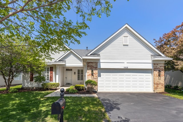 1468 W Grand Haven Rd, Romeoville, IL 60446 - ranch-style home with brick siding, driveway, a front yard, and an attached garage