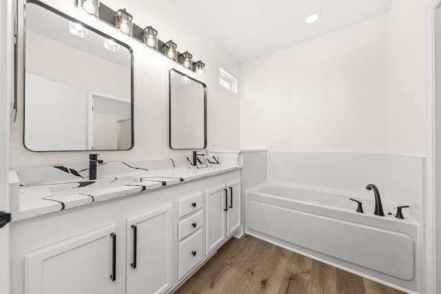 1468 W Grand Haven Rd, Romeoville, IL 60446 - full bath with double vanity, wood finished floors, and a bath