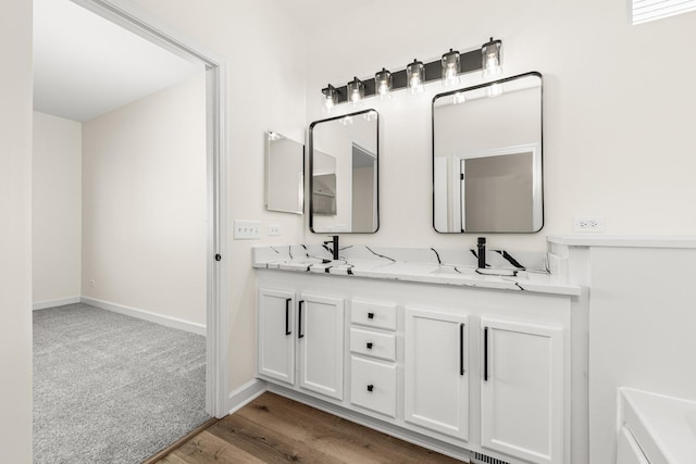 1468 W Grand Haven Rd, Romeoville, IL 60446 - bathroom featuring double vanity, wood finished floors, and baseboards