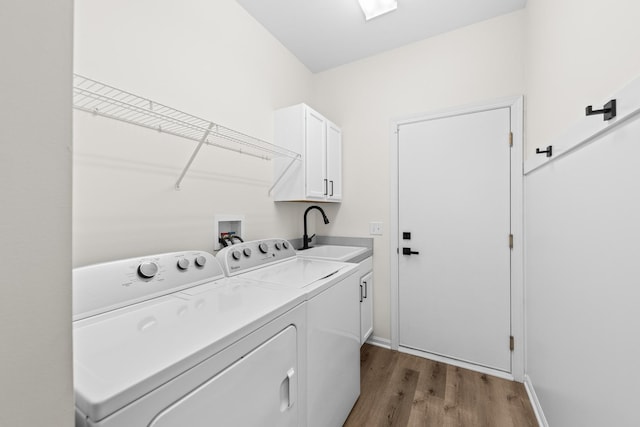 1468 W Grand Haven Rd, Romeoville, IL 60446 - laundry area featuring cabinet space, separate washer and dryer, wood finished floors, and baseboards