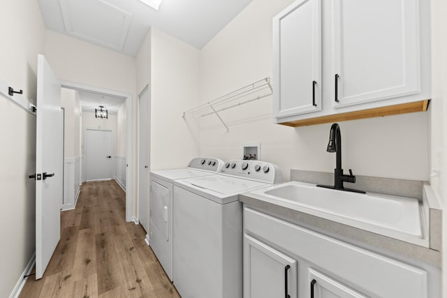 1468 W Grand Haven Rd, Romeoville, IL 60446 - washroom with separate washer and dryer, light wood-type flooring, and cabinet space