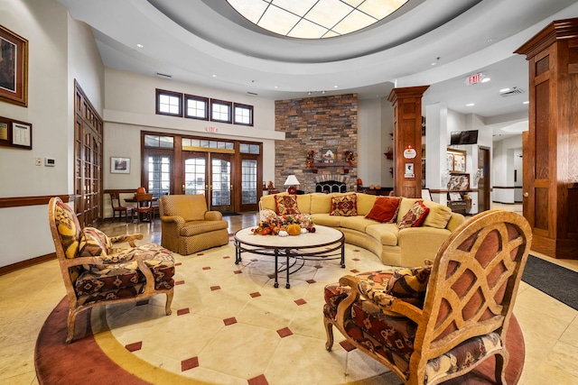 1468 W Grand Haven Rd, Romeoville, IL 60446 - living area featuring french doors, recessed lighting, a towering ceiling, light tile patterned floors, and a fireplace