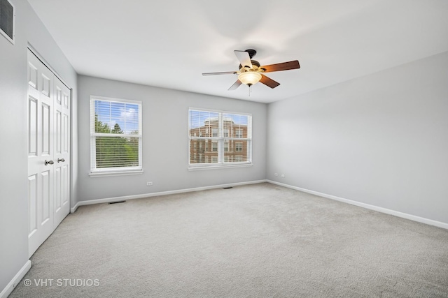 412 W Wood St, Palatine, IL 60067 - unfurnished bedroom featuring baseboards, a closet, carpet floors, and ceiling fan