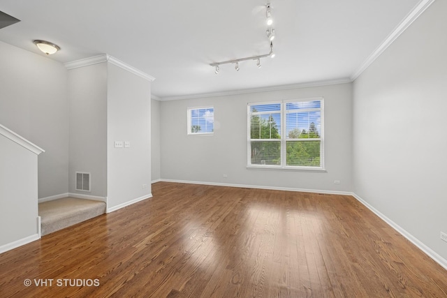412 W Wood St, Palatine, IL 60067 - unfurnished room with baseboards, wood finished floors, stairs, crown molding, and rail lighting