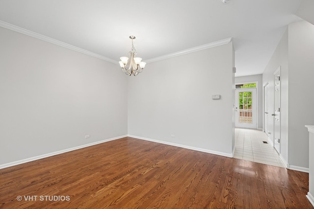 412 W Wood St, Palatine, IL 60067 - unfurnished room featuring a chandelier, baseboards, wood finished floors, and crown molding