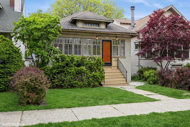 533 Clarence Ave, Oak Park, IL 60304 - view of front of house featuring a front yard and roof with shingles