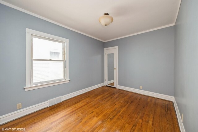 533 Clarence Ave, Oak Park, IL 60304 - unfurnished room featuring ornamental molding, baseboards, and wood finished floors