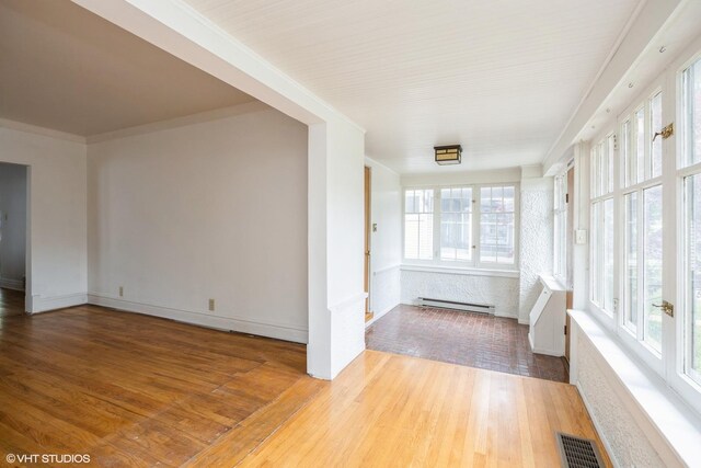 533 Clarence Ave, Oak Park, IL 60304 - unfurnished sunroom with baseboard heating
