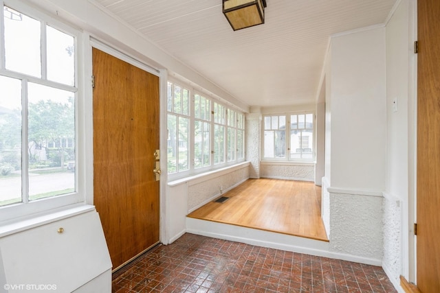 533 Clarence Ave, Oak Park, IL 60304 - unfurnished sunroom with baseboards and brick patterned floors