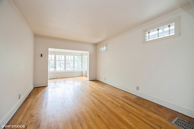 533 Clarence Ave, Oak Park, IL 60304 - unfurnished room with crown molding, healthy amount of natural light, light wood finished floors, and baseboards
